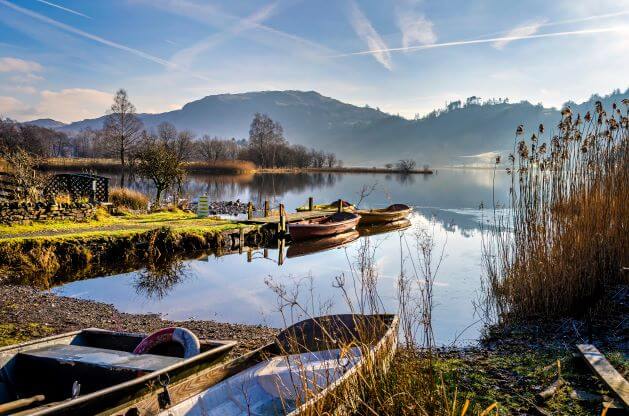 5 UK staycations and what to pack for them 1 boats on Grasmere water in the perfect uk staycation spot