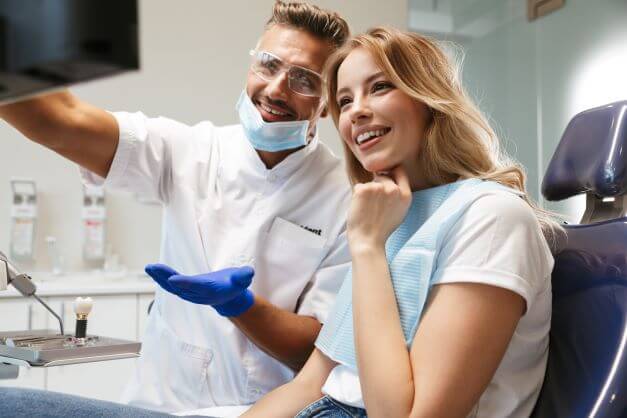 dentist explaining Cosmetic Dental Procedures