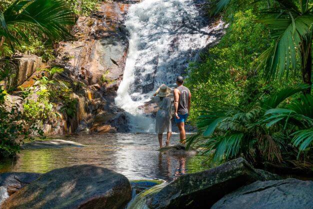 Couple at a waterfall in the Seychelles