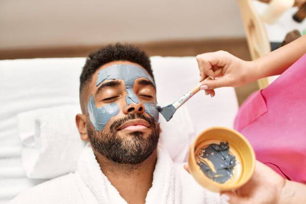 man getting facial treatment