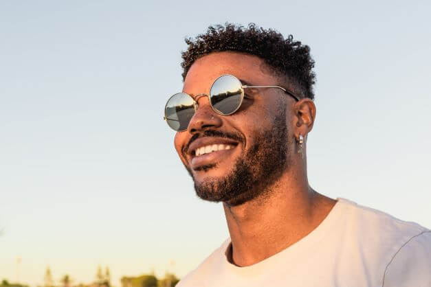 man in sunglasses and white t shirt