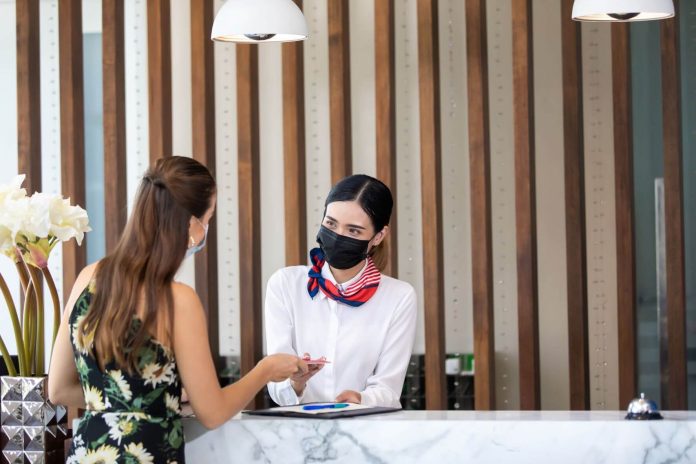 hotel reception staff in mask
