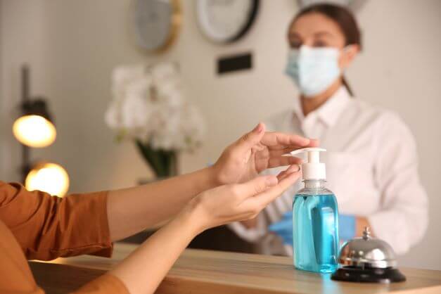 masks and hand gel at hotel reception