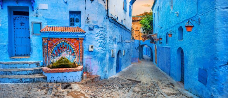 The Best Countries to Visit in Africa in your Lifetime 9 Fountain with drinking water on house coloured wall in blue town Chefchaouen. Morocco, North Africa