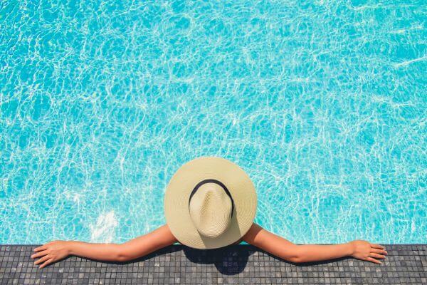 A woman lounging in swimming pools