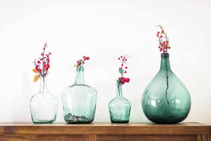 a row of glass vases