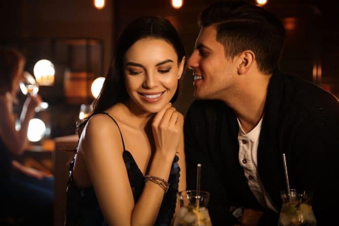 couple flirting in bar