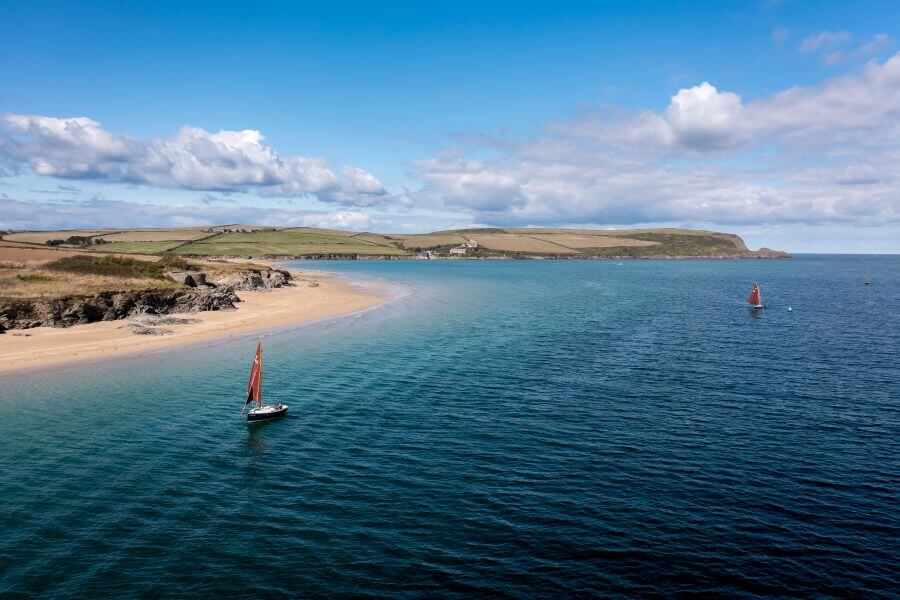 4 UK destinations for dinghy sailing beginners 2 sailboats in Cornwall