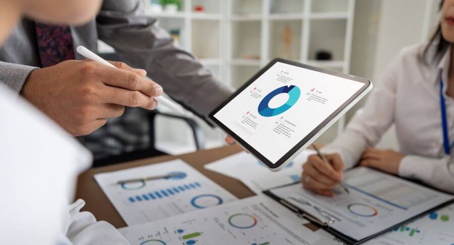 Business professionals analyzing data and documents in a meeting room