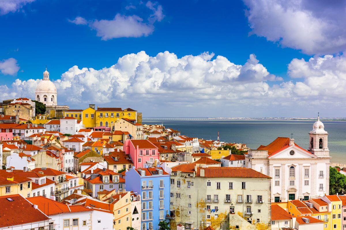 Colourful rooftops and historic buildings overlooking the river in Lisbon, Portugal