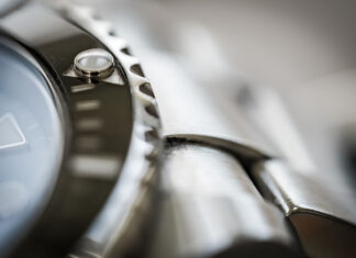 Why buy a pre-owned luxury watch? The appeal and the checks that matter Close-up of a watch bezel, case and steel bracelet