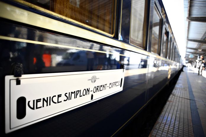 Venice Simplon-Orient-Express carriage Blue and gold Venice Simplon-Orient-Express carriage with its name displayed beside the platform